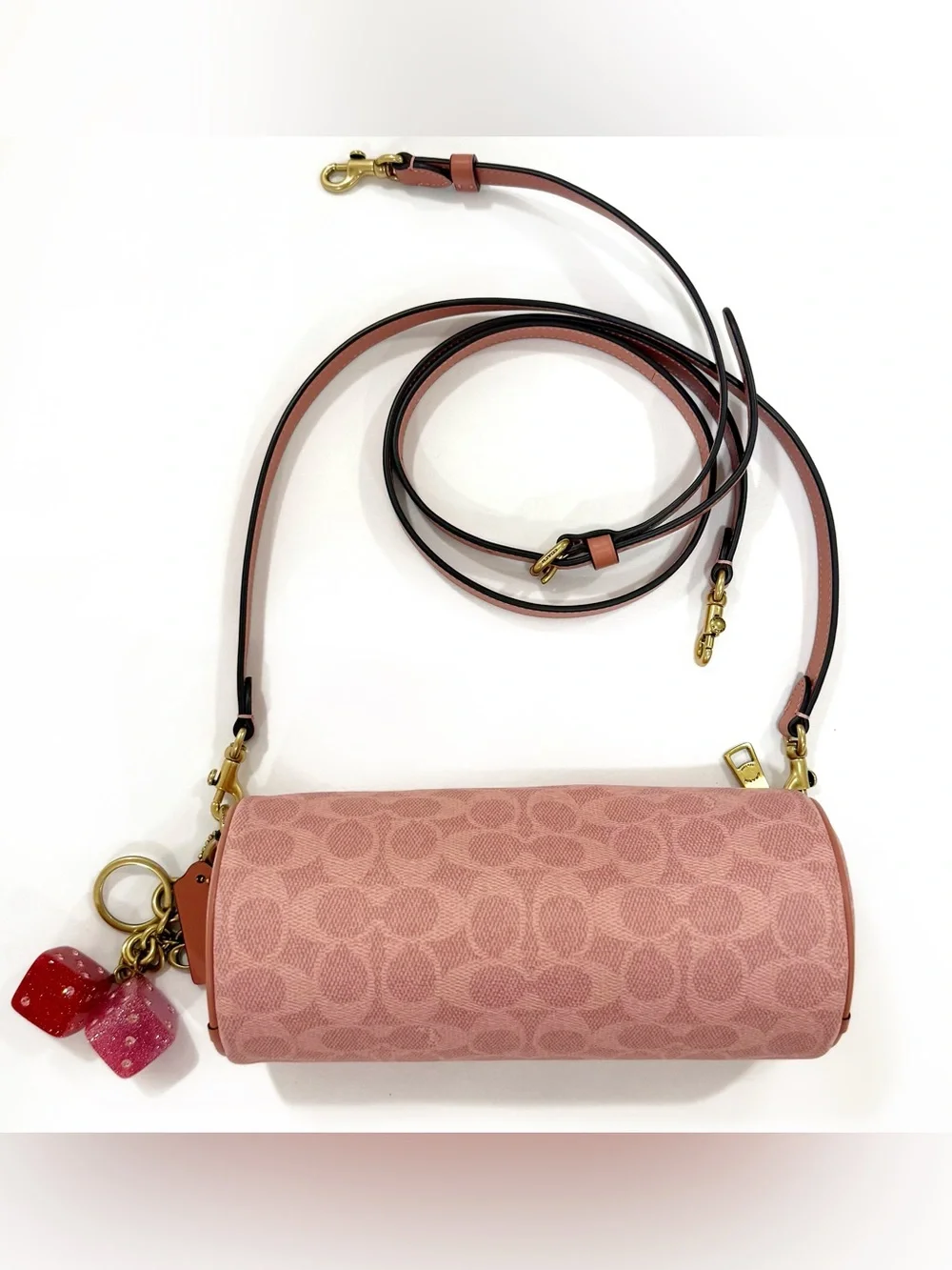 New Coach cylinder barrel bag in melon pink/ brass with signature canvas